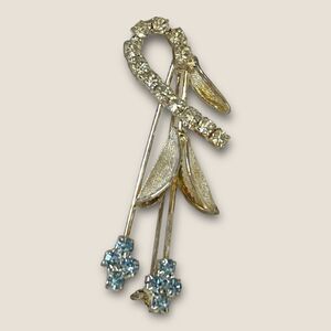 Silver plated flower brooch blue crystals, vintage
